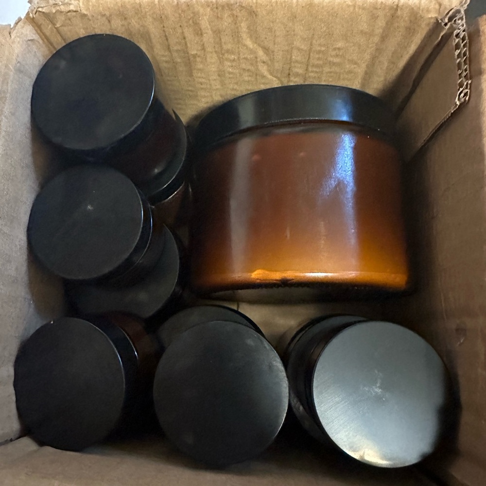 Box of tallow lotion with glass jars